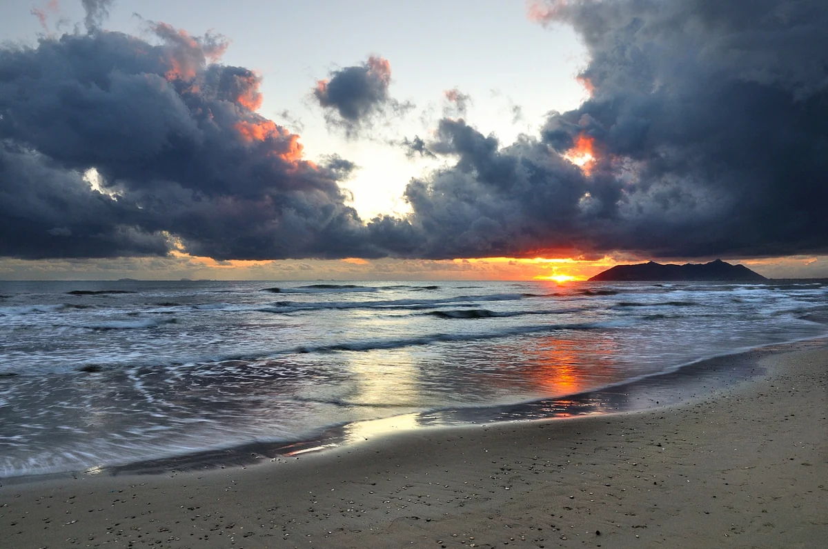 The sea at Terracina with low clouds and Monte Circeo in the background.